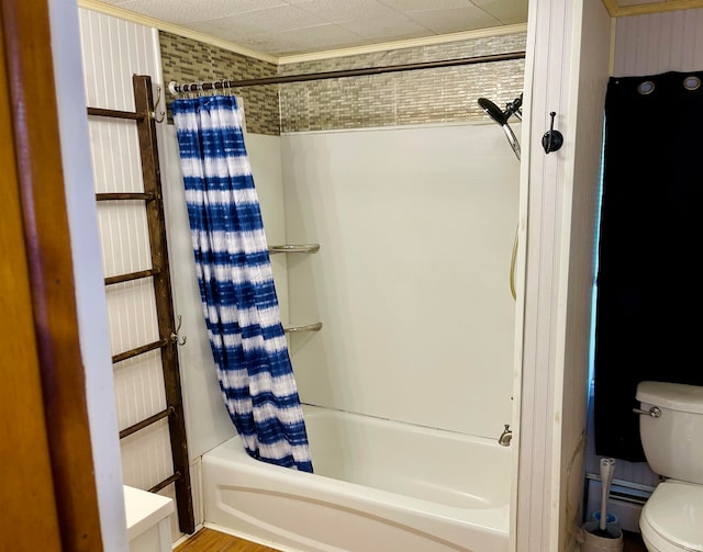 bathroom featuring toilet, shower / bathtub combination with curtain, and a baseboard radiator