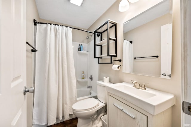 full bathroom with toilet, hardwood / wood-style floors, a textured ceiling, vanity, and shower / bath combination with curtain