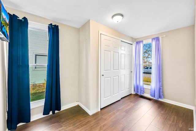 foyer with dark wood-type flooring