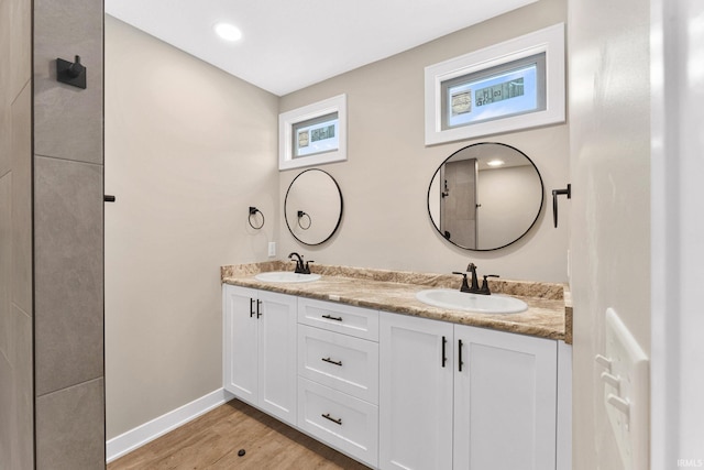 bathroom with vanity and hardwood / wood-style flooring