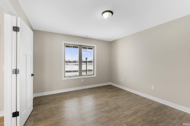 unfurnished room featuring wood-type flooring