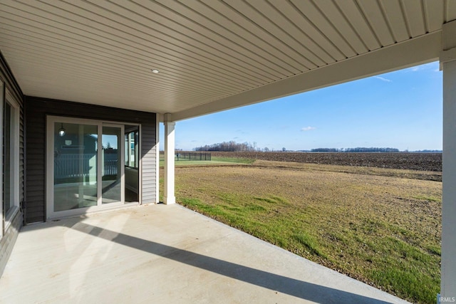 view of patio with a rural view