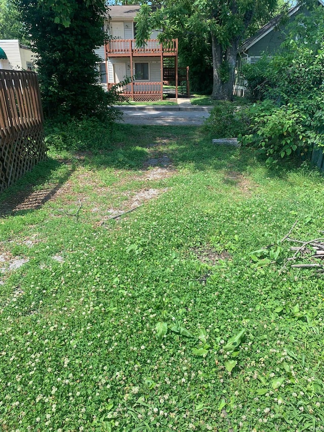 view of yard with a wooden deck