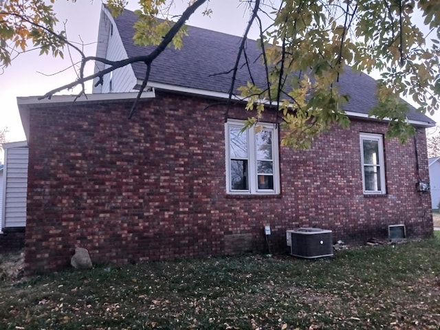 view of property exterior with central AC