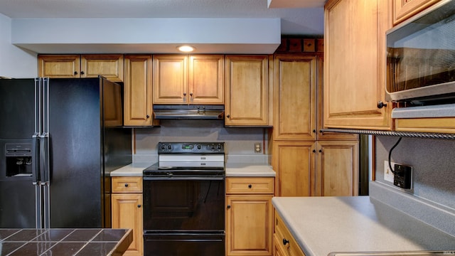 856 S Balthazar Dr, Santa Claus, IN 47579 - kitchen featuring black appliances, under cabinet range hood, and light countertops