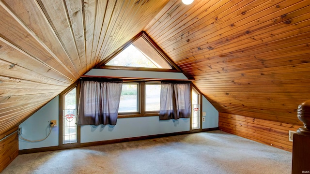 additional living space with light colored carpet, wooden walls, vaulted ceiling, and wooden ceiling