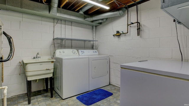 856 S Balthazar Dr, Santa Claus, IN 47579 - laundry room featuring concrete block wall and washer and dryer
