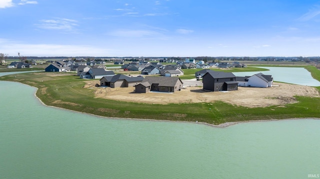 aerial perspective of suburban area featuring a nearby body of water