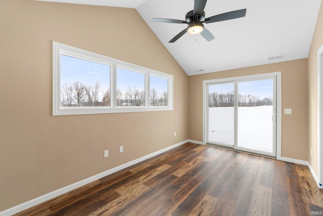 spare room featuring vaulted ceiling, dark hardwood / wood-style floors, and ceiling fan