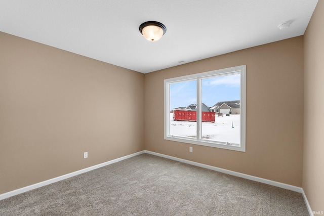 view of carpeted spare room