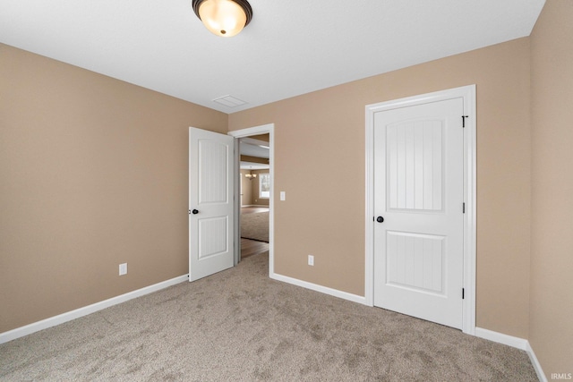 unfurnished bedroom featuring light colored carpet