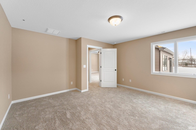 unfurnished bedroom featuring light carpet