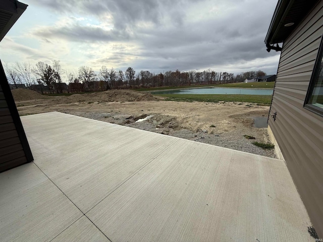 view of patio featuring a water view