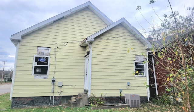 view of side of property with central AC