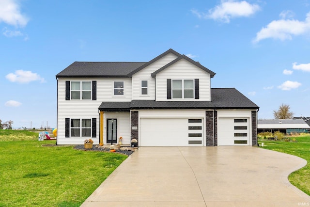 view of front facade featuring a garage and a front yard