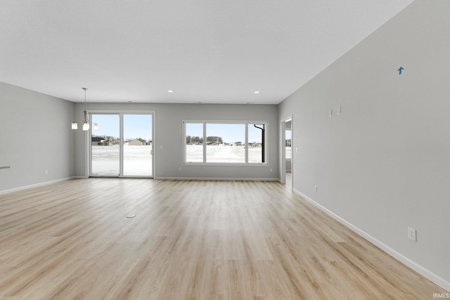 1333 Zenos Blvd, Fort Wayne, IN 46818 - unfurnished living room with light wood-type flooring, baseboards, and recessed lighting