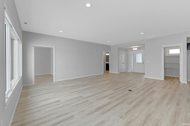 1333 Zenos Blvd, Fort Wayne, IN 46818 - unfurnished living room featuring light wood-style floors, baseboards, and recessed lighting
