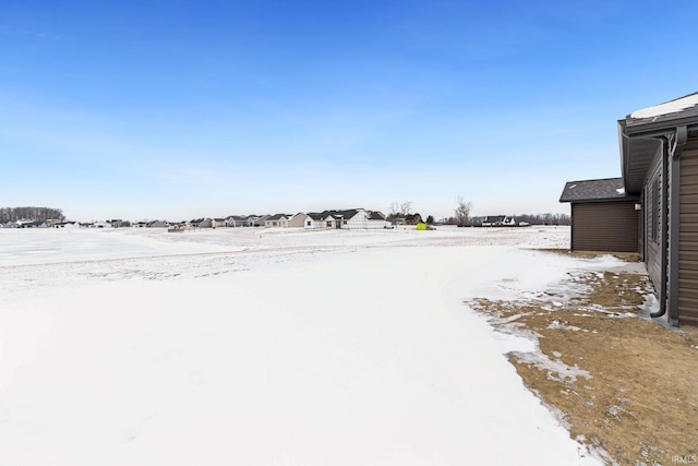 view of yard covered in snow