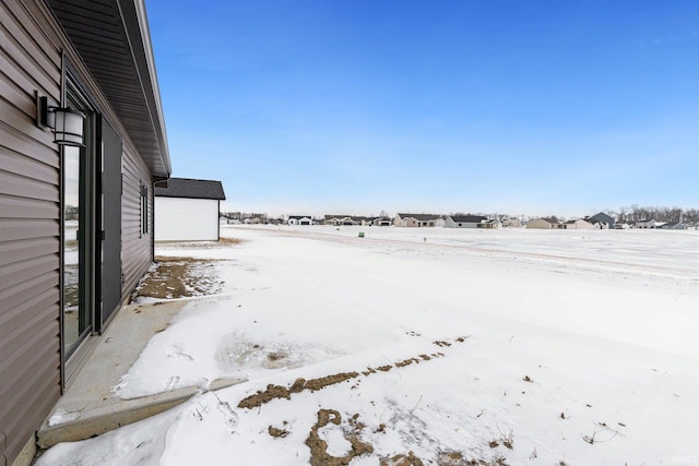 view of yard covered in snow