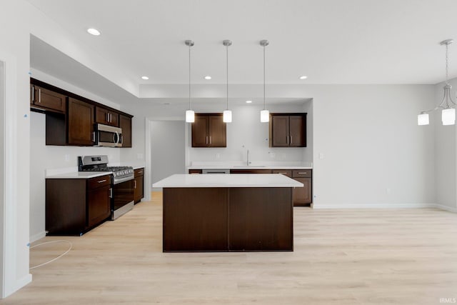1333 Zenos Blvd, Fort Wayne, IN 46818 - kitchen with appliances with stainless steel finishes, a sink, light wood-style flooring, light countertops, and recessed lighting