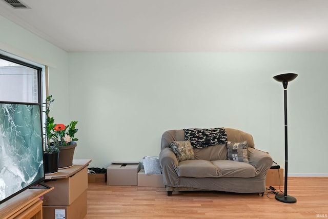 sitting room featuring light hardwood / wood-style floors