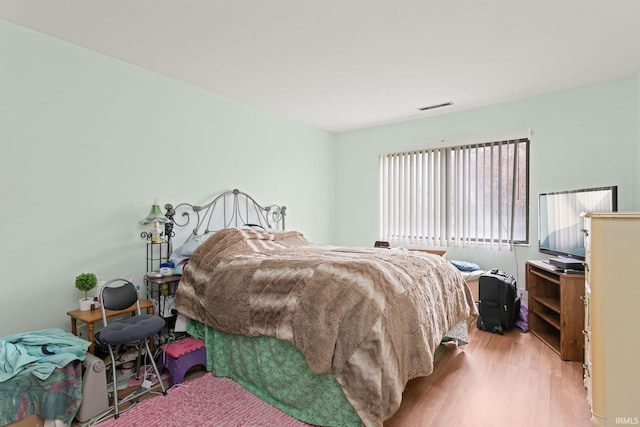 bedroom with light wood-type flooring