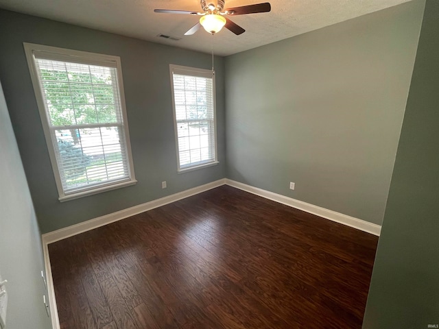 unfurnished room featuring hardwood / wood-style floors, ceiling fan, and a textured ceiling