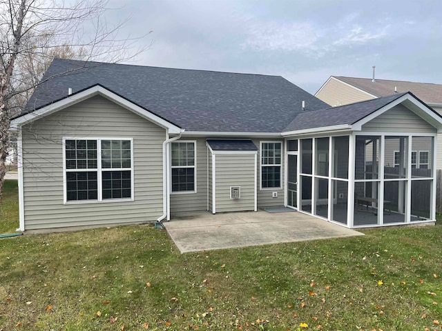 back of house with a patio, a sunroom, and a yard