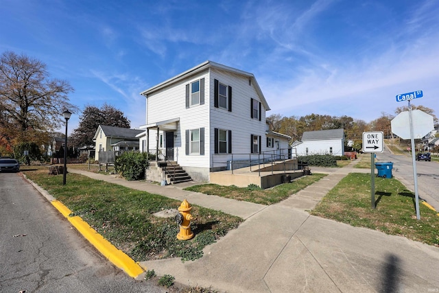 exterior space with a front lawn and a porch