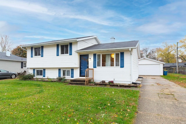 split level home with a front yard, an outdoor structure, and a garage