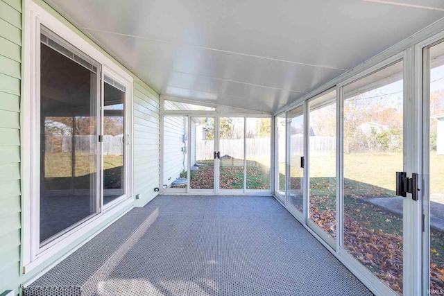 unfurnished sunroom with lofted ceiling