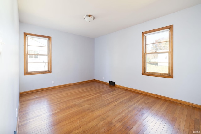 empty room with light wood-type flooring