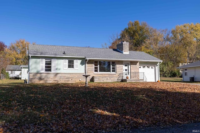 single story home featuring a garage and central AC