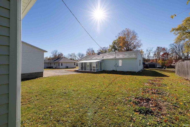 view of yard featuring a sunroom