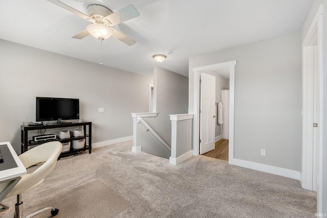 office featuring light carpet and ceiling fan