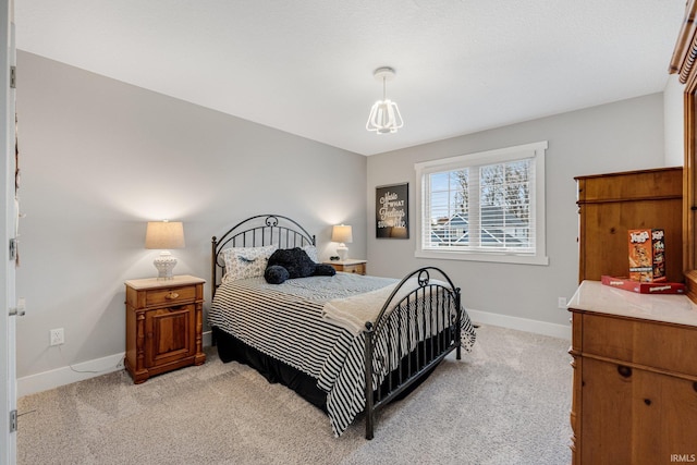 bedroom featuring light carpet