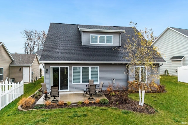 rear view of property with a patio area and a yard