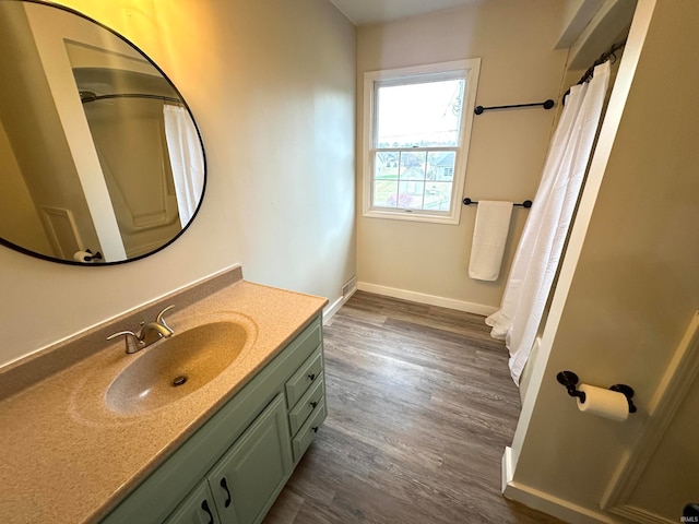 bathroom featuring wood-type flooring and vanity