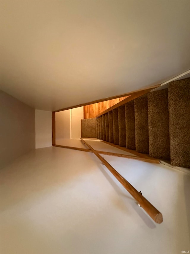 staircase with concrete floors