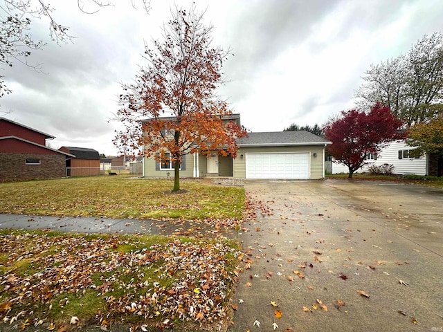 view of front of home with a garage and a front yard