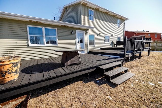 back of house with a wooden deck