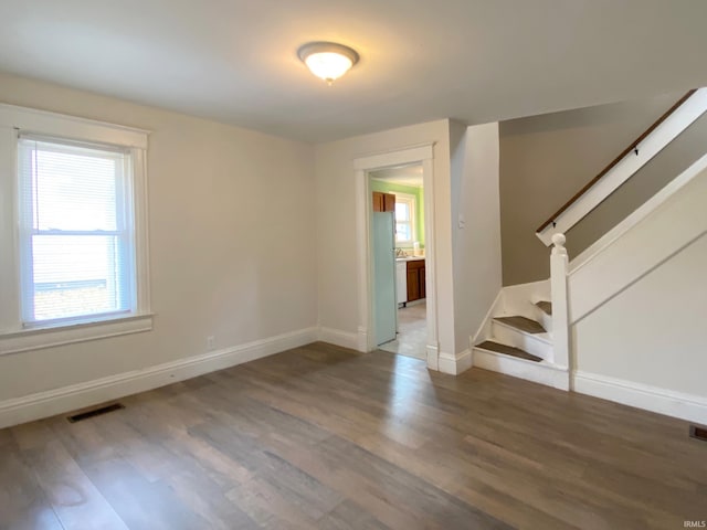 spare room with hardwood / wood-style flooring