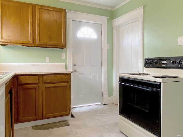 kitchen featuring ornamental molding and electric range