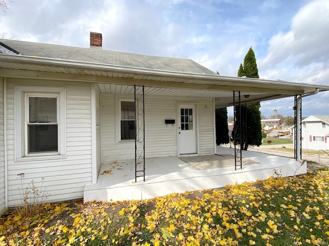 property entrance featuring a patio