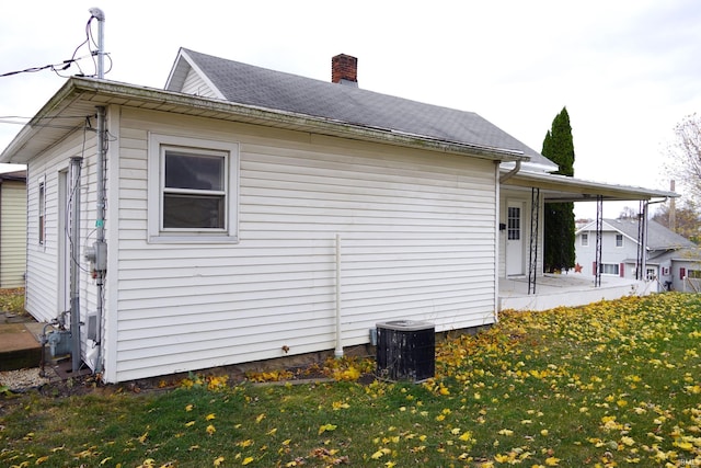 view of home's exterior with a lawn