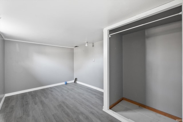 laundry area featuring wood-type flooring