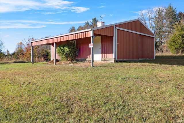 view of outbuilding featuring a lawn