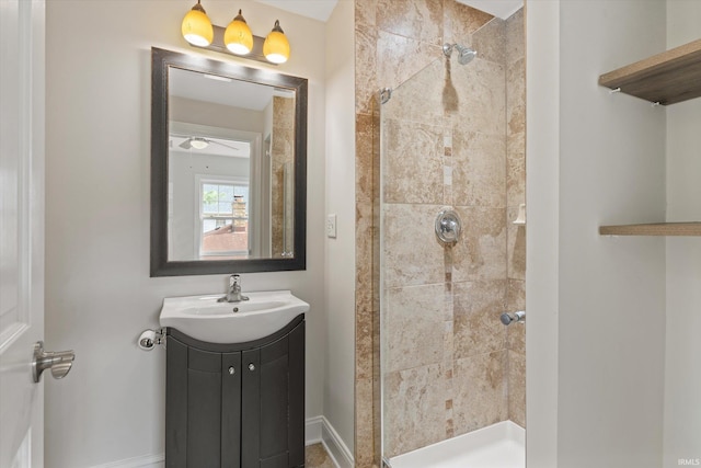 bathroom with vanity and a tile shower