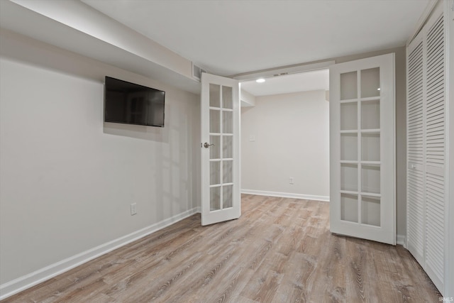 interior space with light hardwood / wood-style flooring and french doors