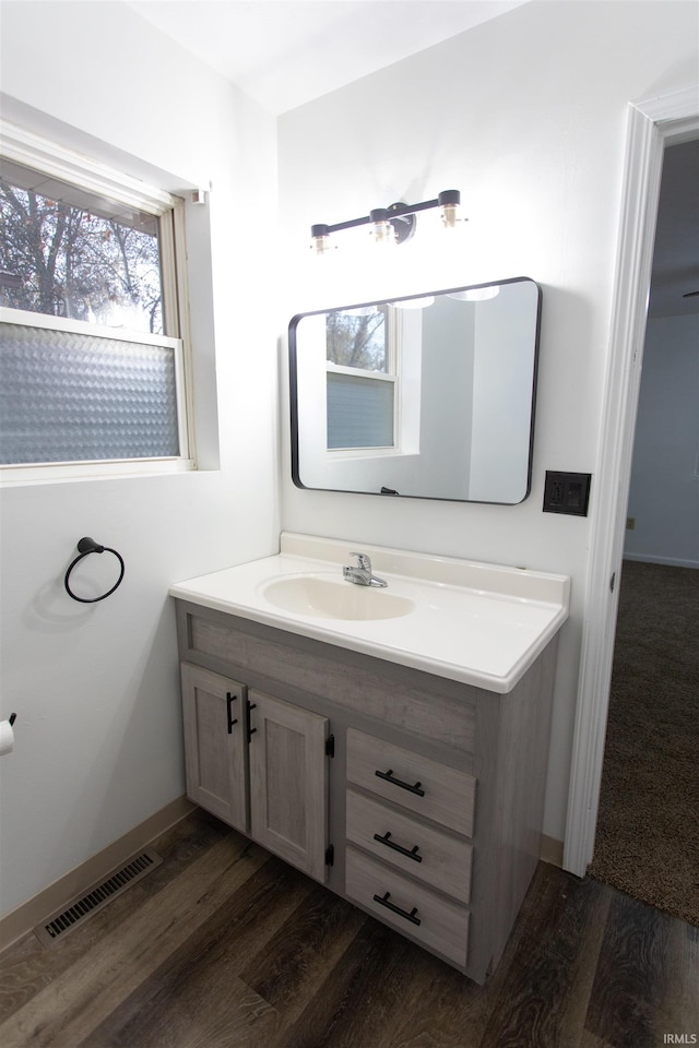 bathroom featuring hardwood / wood-style floors and vanity